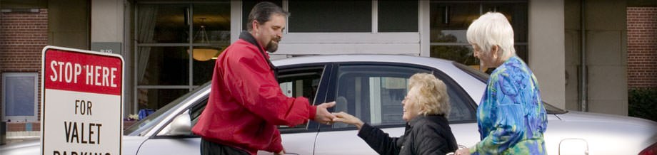 Park Inc valet assisting hospital visitors
